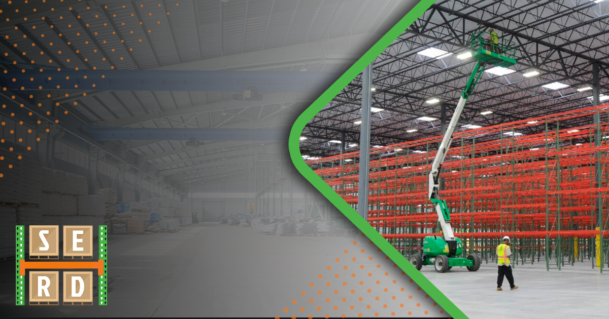 interior-of-warehouse-and-man-on-electric-man-lift-inside-warehouse-storage